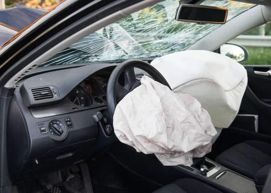 A deployed airbag in a car after a collision