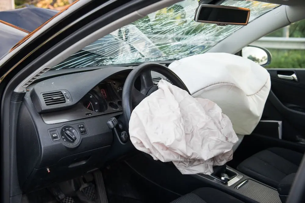 A deployed airbag in a car after a collision